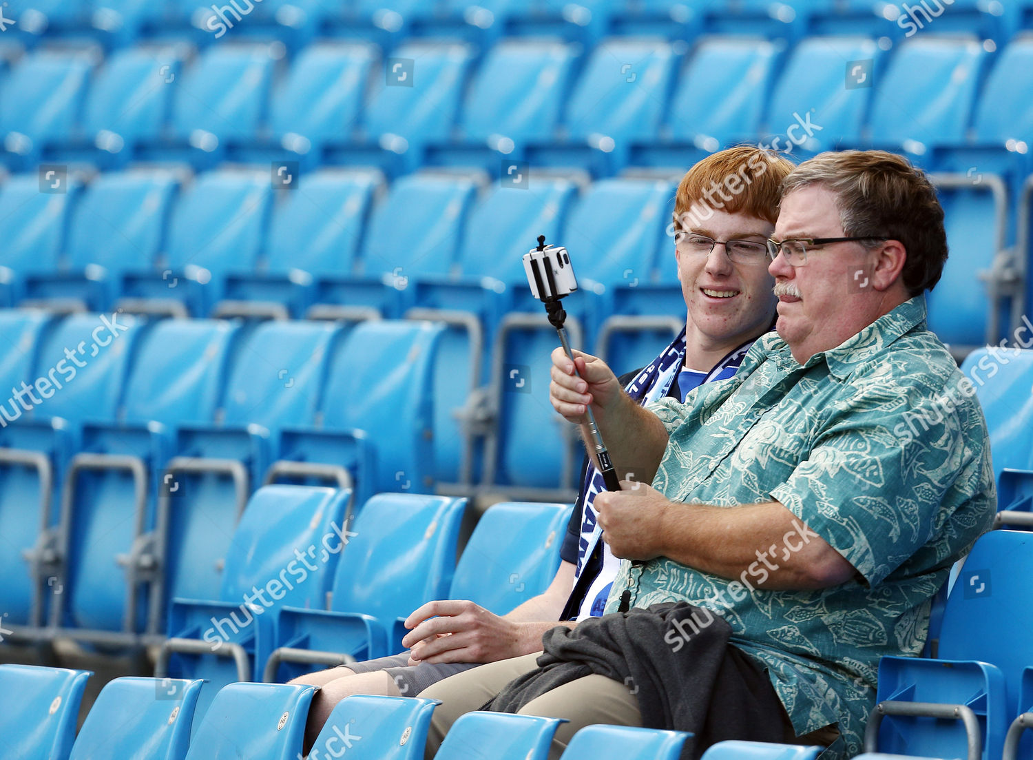 Manchester City Fans Using Mobile Phone Monopod Editorial