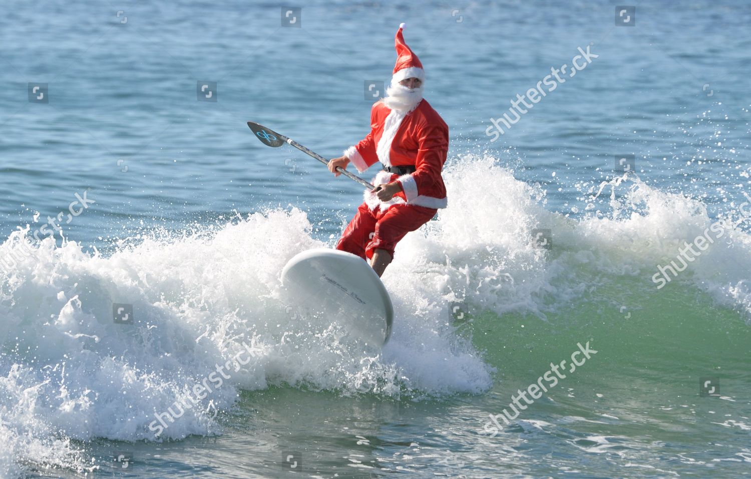 Santa Claus paddle boarding Editorial Stock Photo - Stock | Shutterstock