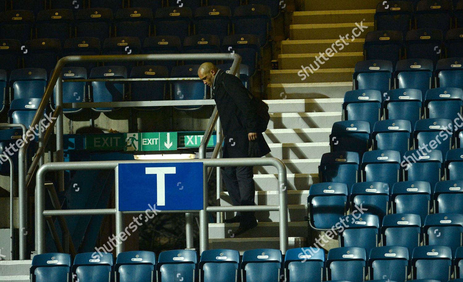 Clarke Carlisle Walks Gingerly Down Stairs End Editorial