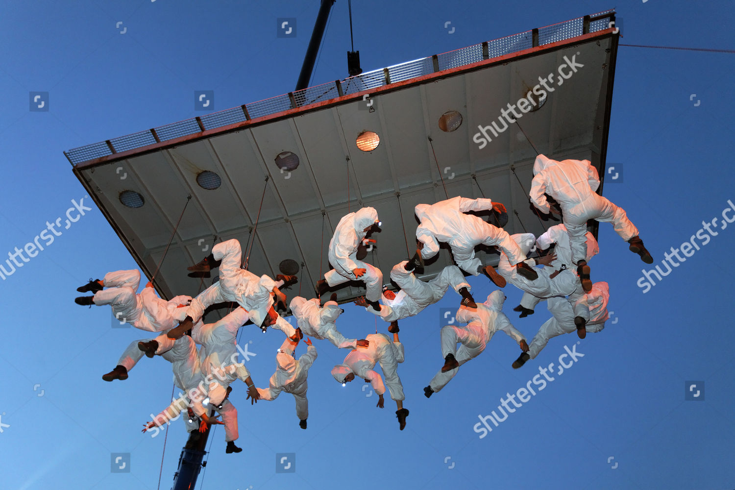 Whiteclad Trapeze Artists Hanging Upside Down Editorial Stock Photo