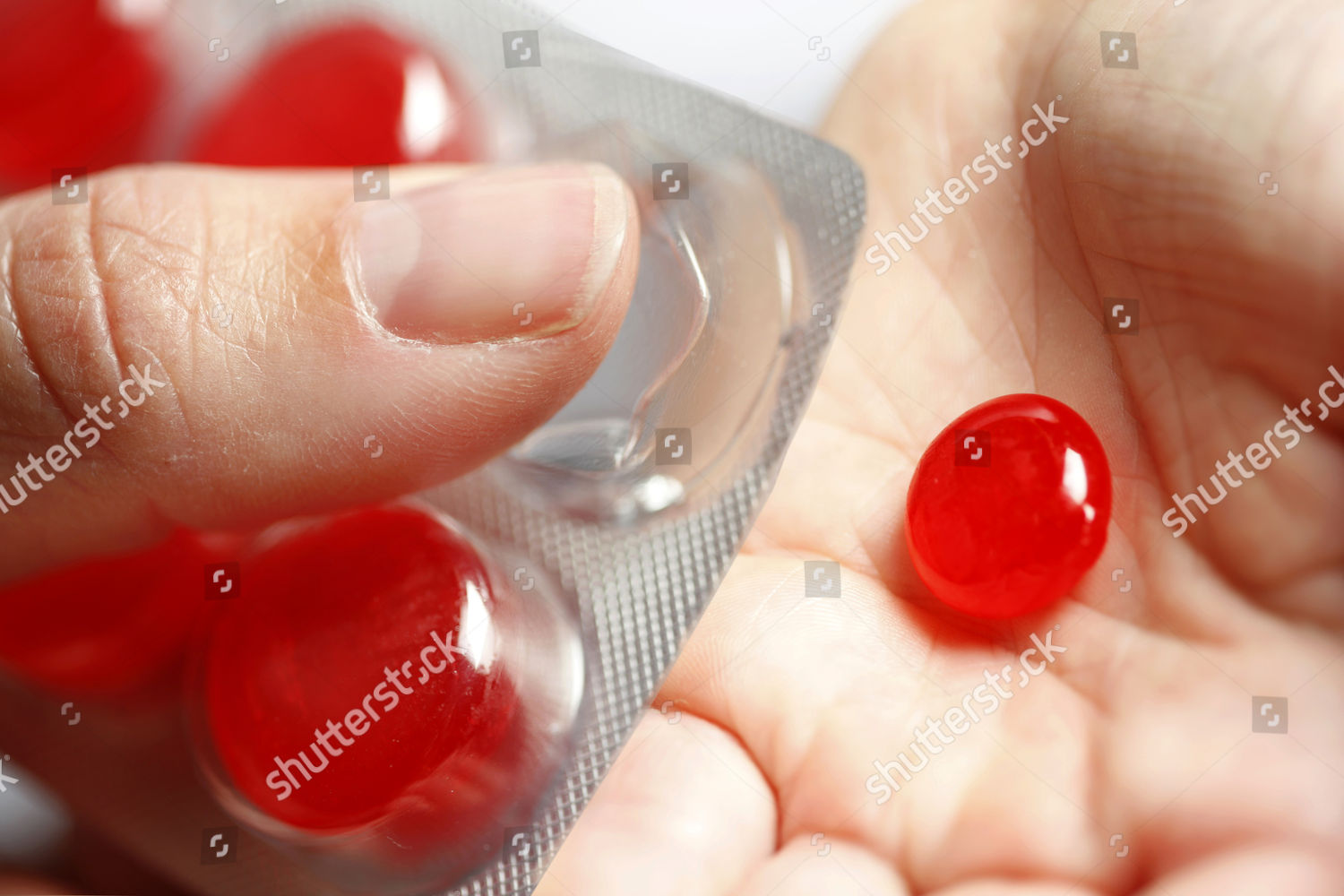 Model Released Throat Lozenges Being Pressed Editorial Stock Photo   Shutterstock 4584276a 