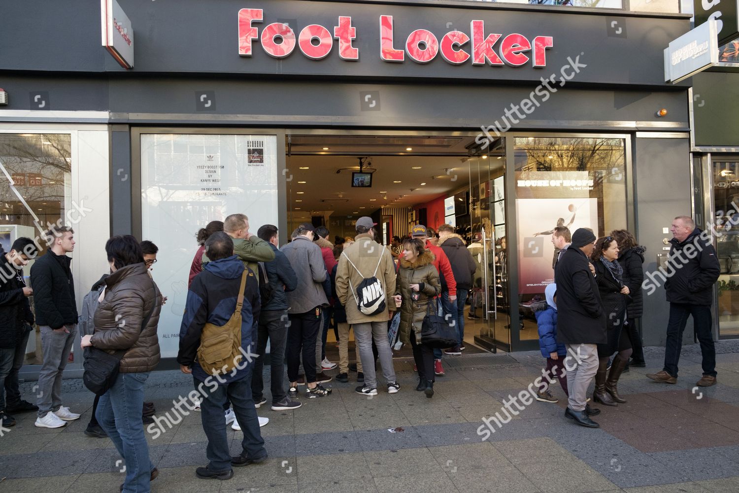 Shoppers queuing outside Foot Locker 