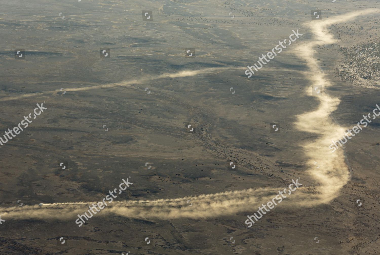 DUST TRAILS LEFT BY VEHICLES DRIVING Editorial Stock Photo Stock