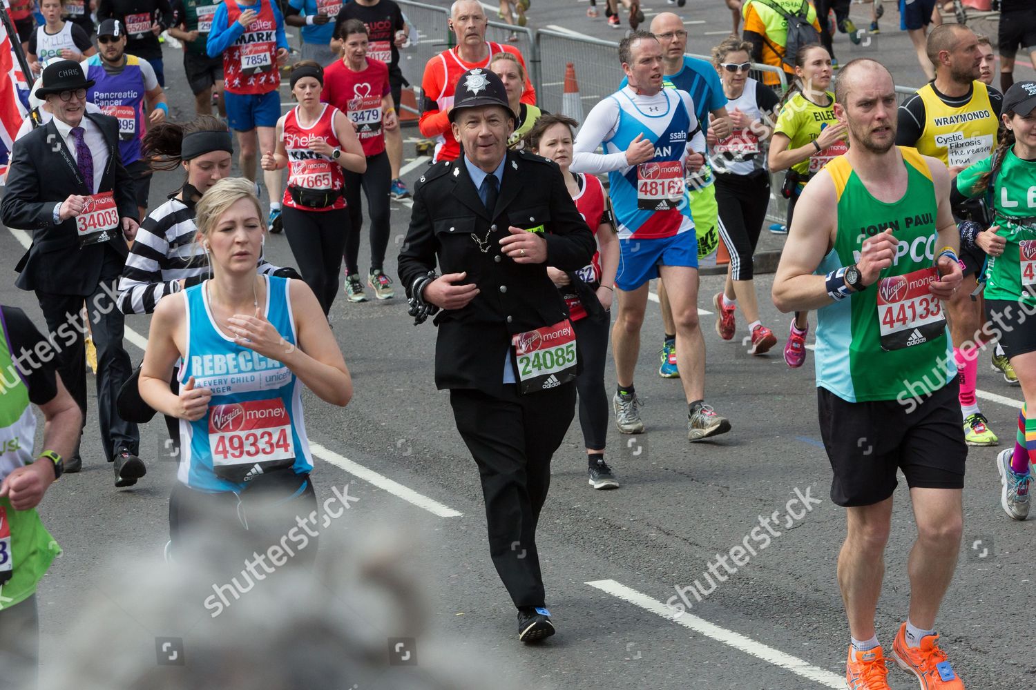 Spectators Watch Fancy Dress Mass Runners Including - 