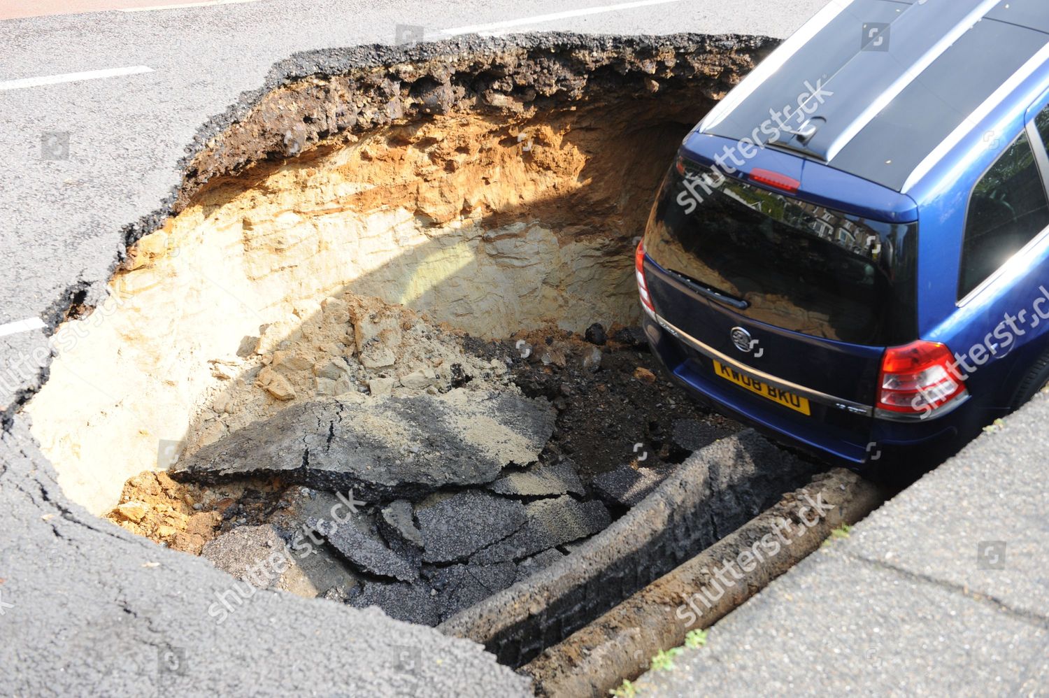 Car Falls Into Big Sink Hole On Editorial Stock Photo