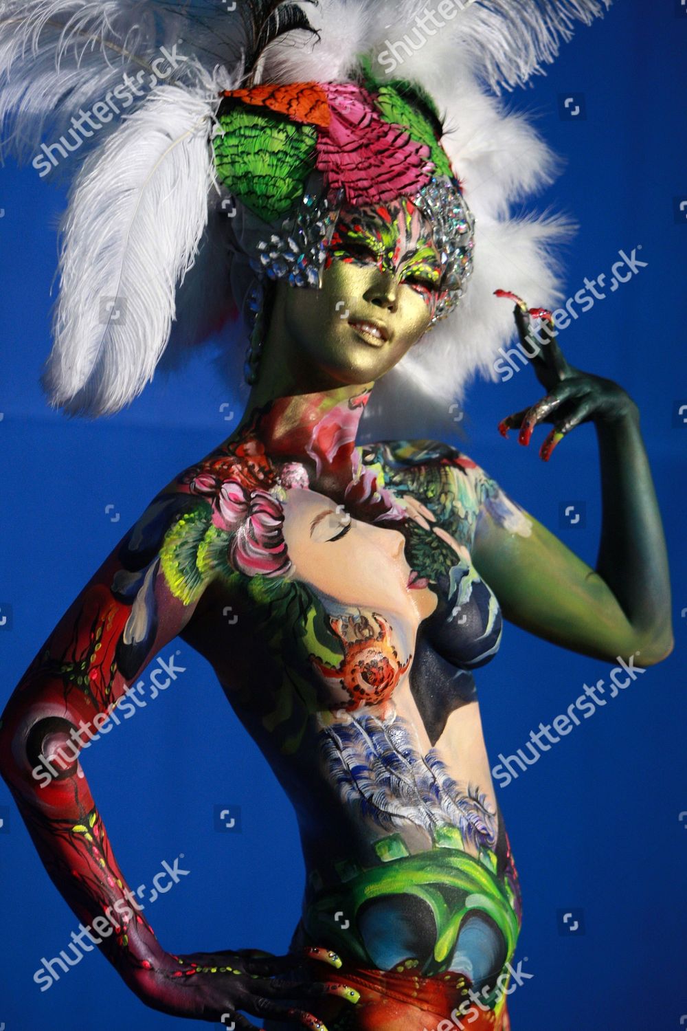 Model Poses During International Body Painting Festival Editorial