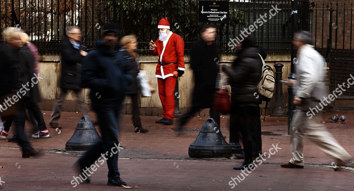 Man Wearing Santa Claus Costume Stands On Editorial Stock Photo