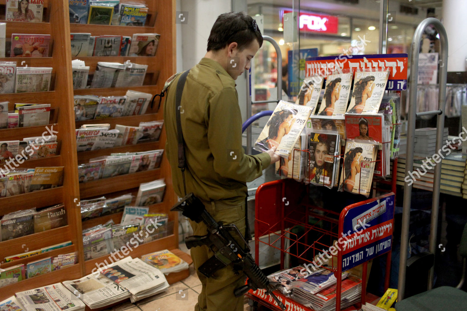 Israeli Soldier Reads Playboy Magazine Kiosk Editorial Stock Photo