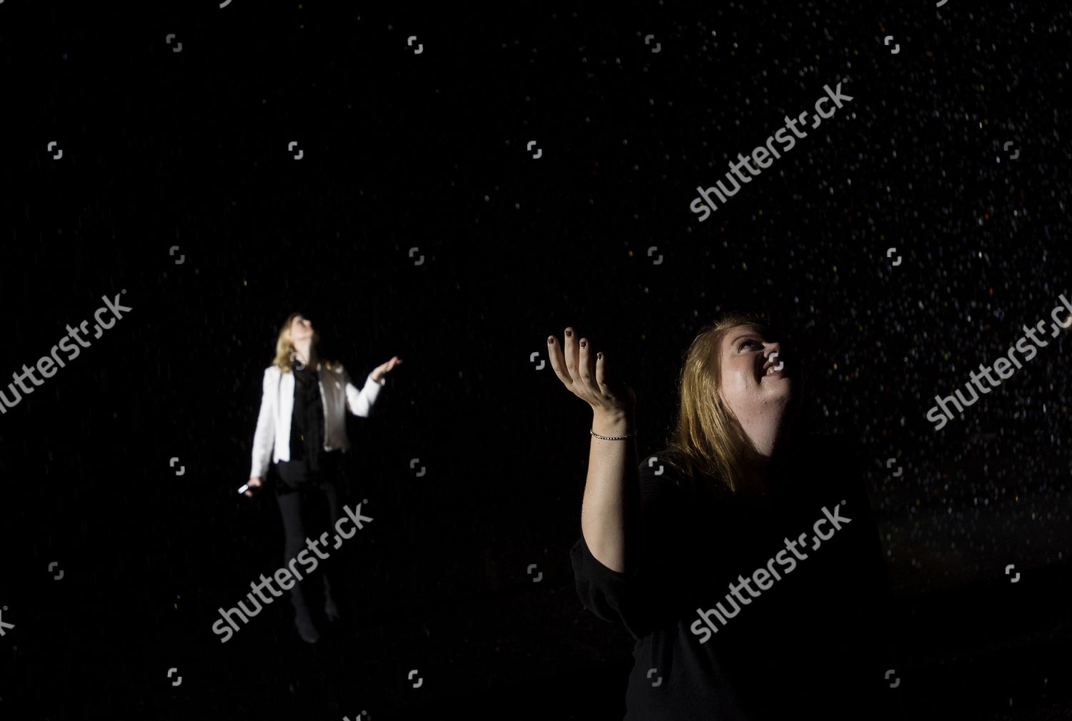 People Walk Through Installation Rain Room Largescale