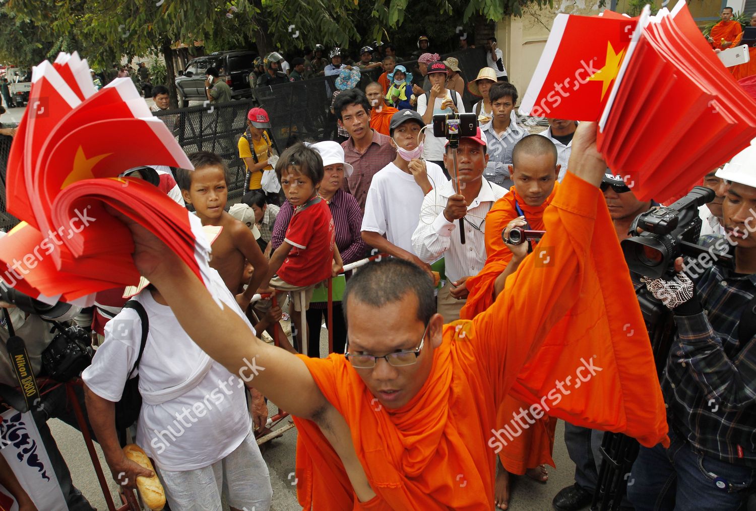 Cambodian Buddhist Monk Holds Vietnamese Flags Editorial Stock Photo ...