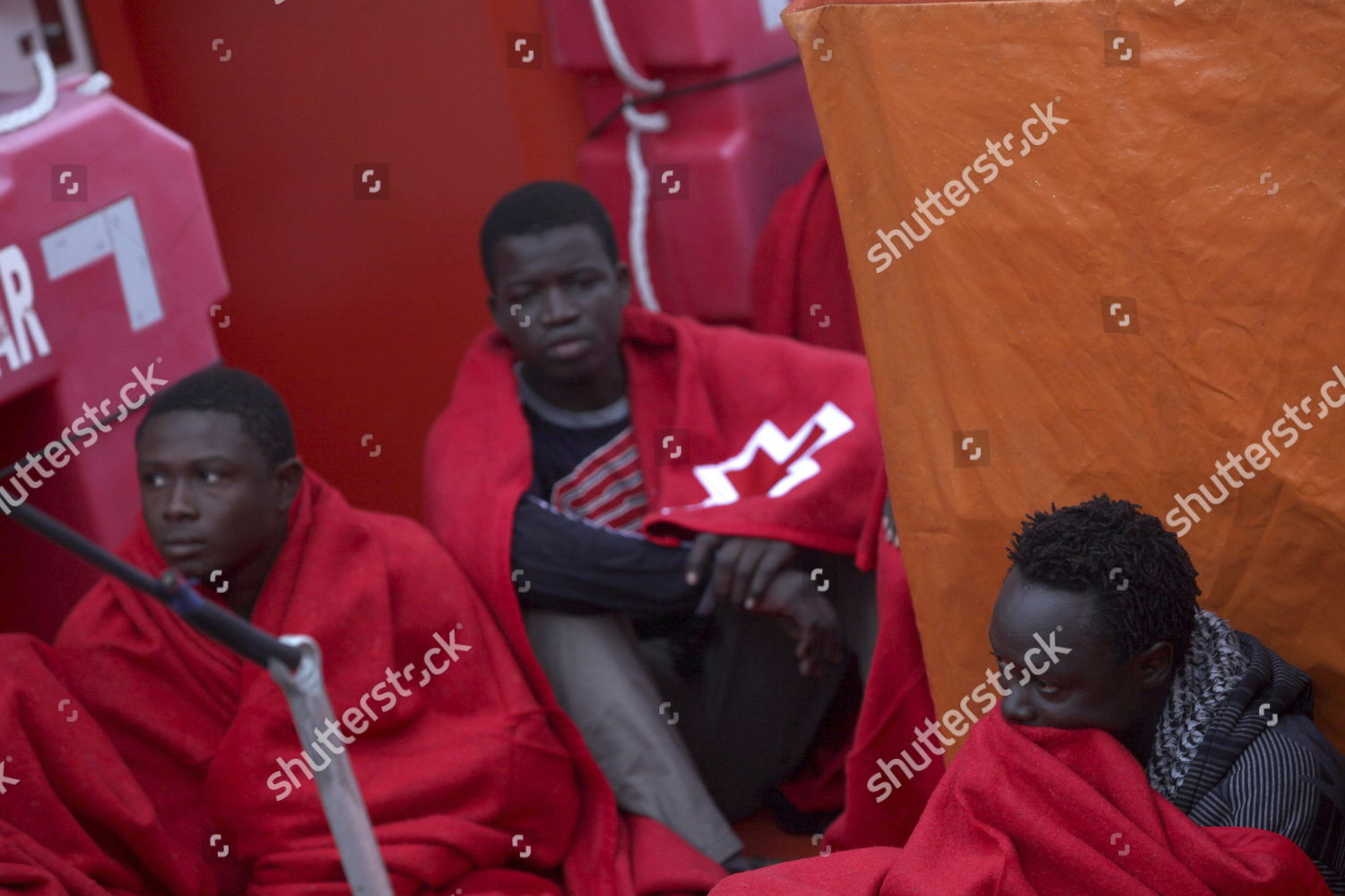 Immigrants Covered Blankets They Arrive Shore Editorial Stock Photo