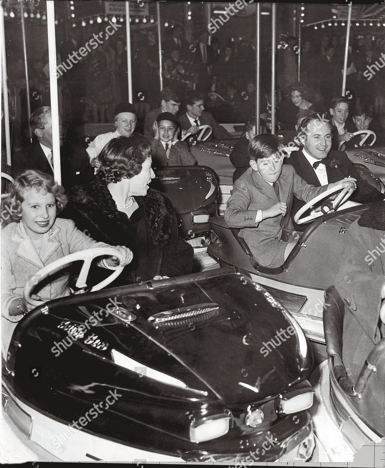 prince-charles-riding-the-dodgems-with-friends-in-december-1959-the-princess-royal-is-driving-the-other-dodgem-picture-as-used-in-the-mail-on-sunday-supplement-charles-the-princes-story-part-two-devoted-parents-strangers-to-each-other-written-b-shutterstock-editorial-884138a.jpg