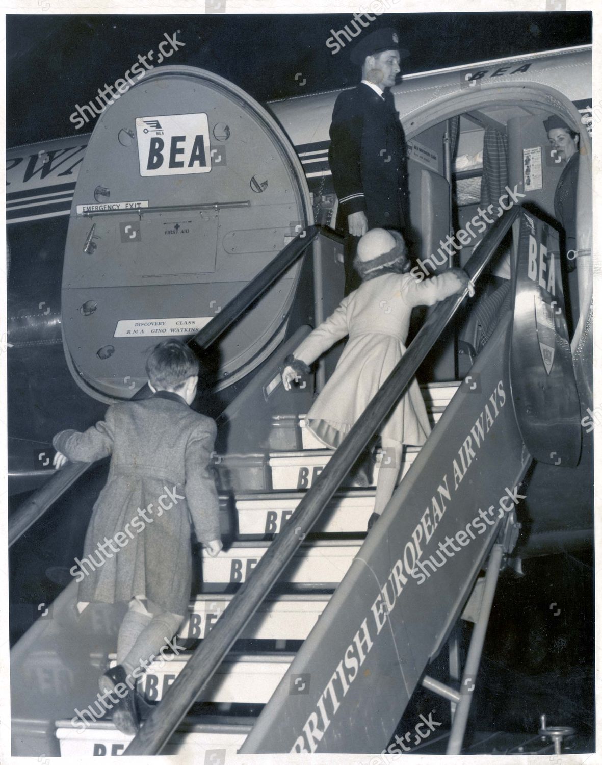 the-prince-of-wales-21st-february-1957-prince-charles-and-princess-anne-rush-up-the-stairway-to-greet-their-parents-who-had-just-returned-from-portugal-royalty-shutterstock-editorial-884384a.jpg