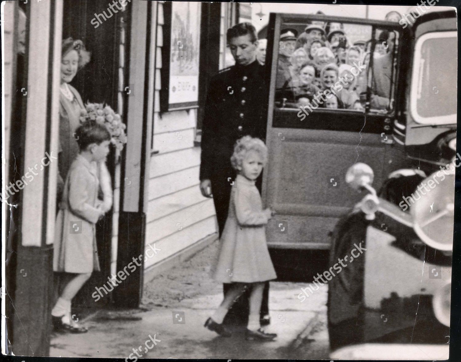 princess-anne-august-1954-eagerly-smiling-women-some-of-whom-had-waited-for-hours-get-a-brief-glimpse-of-prince-charles-and-princess-anne-as-they-walk-sedately-to-their-car-at-ballater-station-yesterday-with-the-queen-mother-they-had-travelled-ove-shutterstock-editorial-884977a.jpg