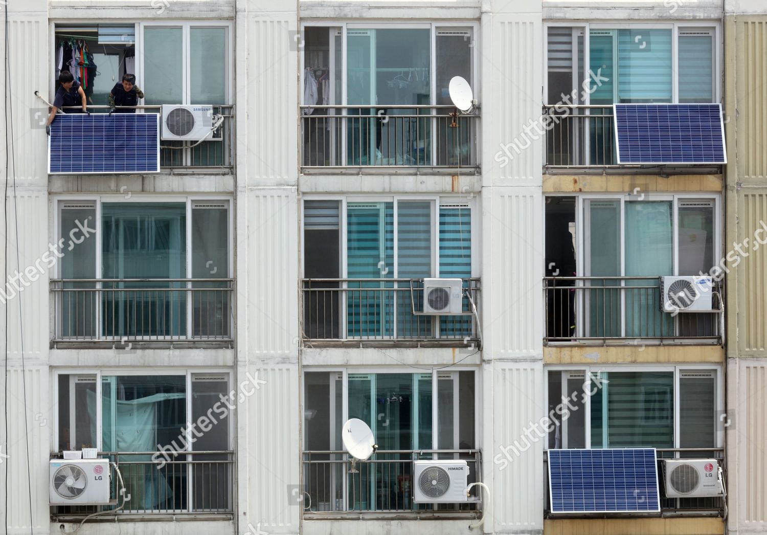 Workers install solar modules on apartment balconies Editorial Stock Photo - Stock Image | Shutterstock