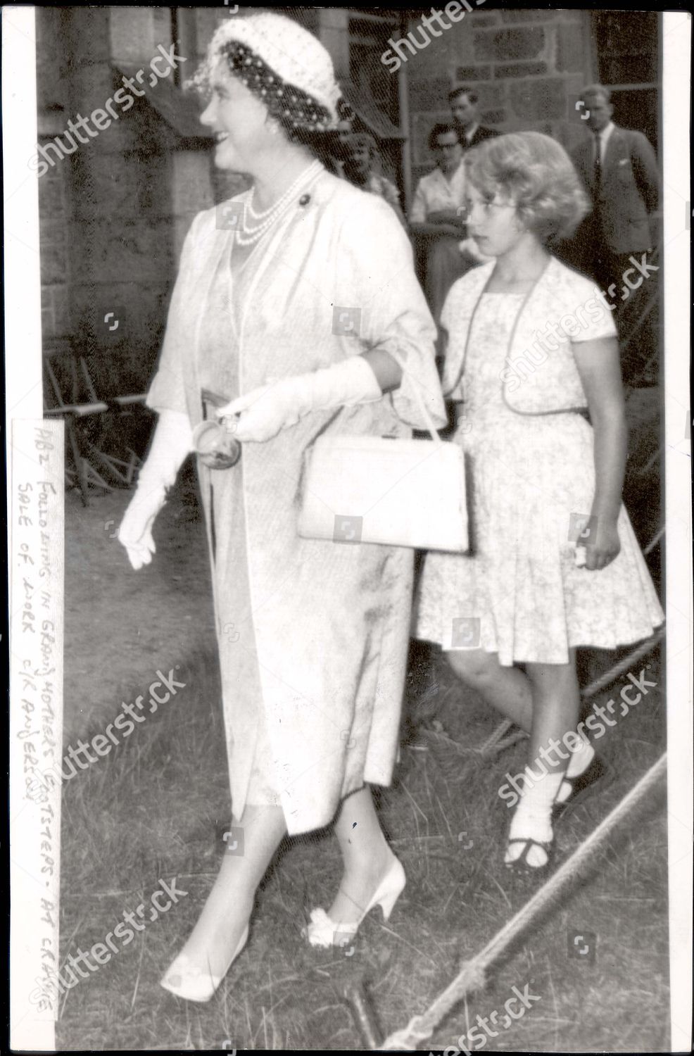 queen-elizabeth-queen-mother-died-30-3-02-1959-princess-anne-stands-among-the-sightseers-at-crathie-church-sale-of-work-yesterday-she-was-watching-the-queen-mother-who-had-brought-her-from-balmoral-for-a-lightning-20-minute-shopping-tour-buying-shutterstock-editorial-888256a.jpg