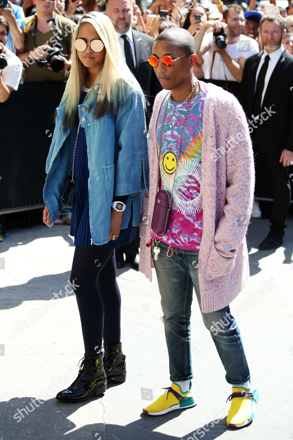 Pharrell Williams and Helen Lasichanh arriving to the Chanel show