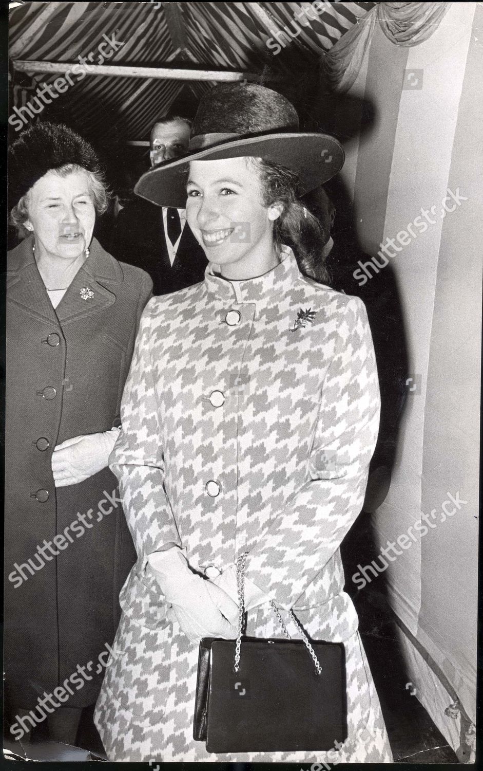 princess-anne-now-princess-royal-4-november-1969-a-smiling-princess-anne-sporting-a-pony-tail-and-wearing-a-wide-brimmed-hat-and-two-piece-costume-seen-at-the-wedding-at-st-michaels-church-chester-square-london-this-afternoon-of-mr-george-pilking-shutterstock-editorial-890850a.jpg