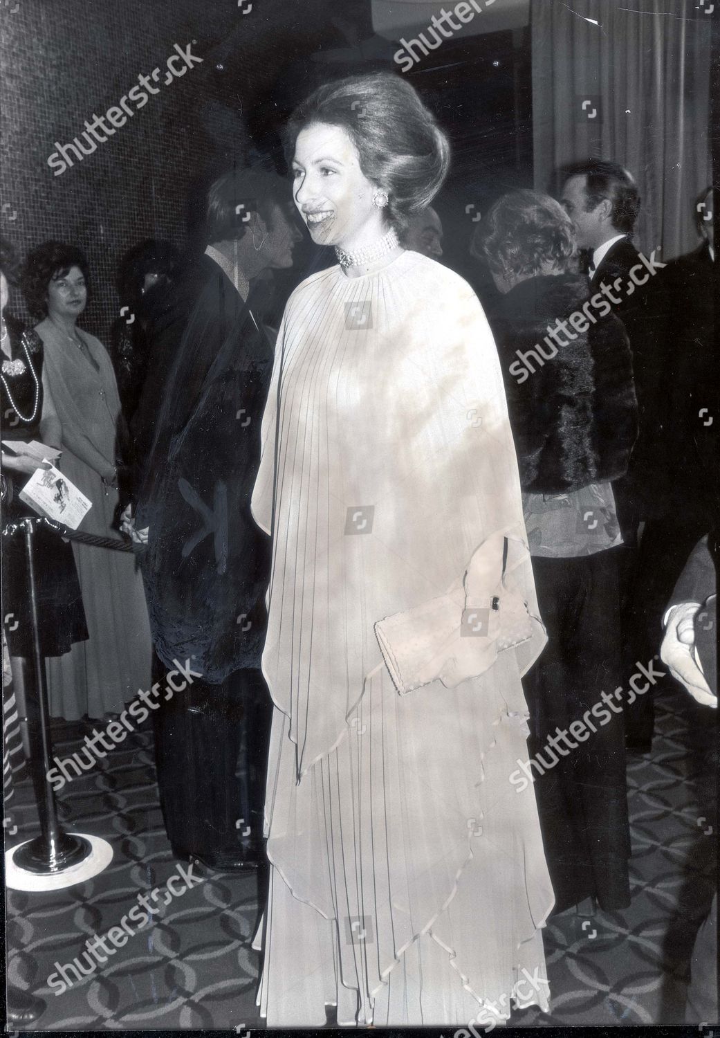 princess-anne-now-princess-royal-november-1978-in-shimmering-pleaed-dress-and-fourt-strand-pearl-choker-princess-anne-swept-all-before-her-last-night-she-was-the-guest-of-honour-right-at-the-first-night-in-londons-leicester-square-theatre-of-t-shutterstock-editorial-890879a.jpg