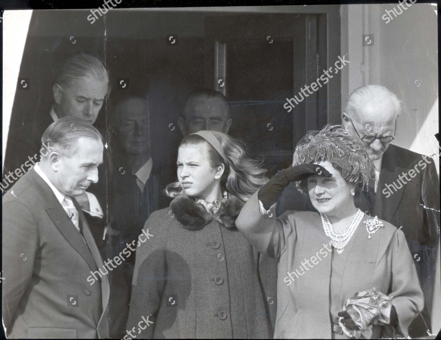 queen-elizabeth-queen-mother-1963-28-march-1963-it-was-only-ten-minutes-but-it-seemed-like-an-age-for-princess-anne-now-princess-royal-as-she-waited-for-the-queen-elizabeth-ii-to-come-home-yesterday-she-stood-with-the-queen-mother-at-the-e-shutterstock-editorial-894274a.jpg