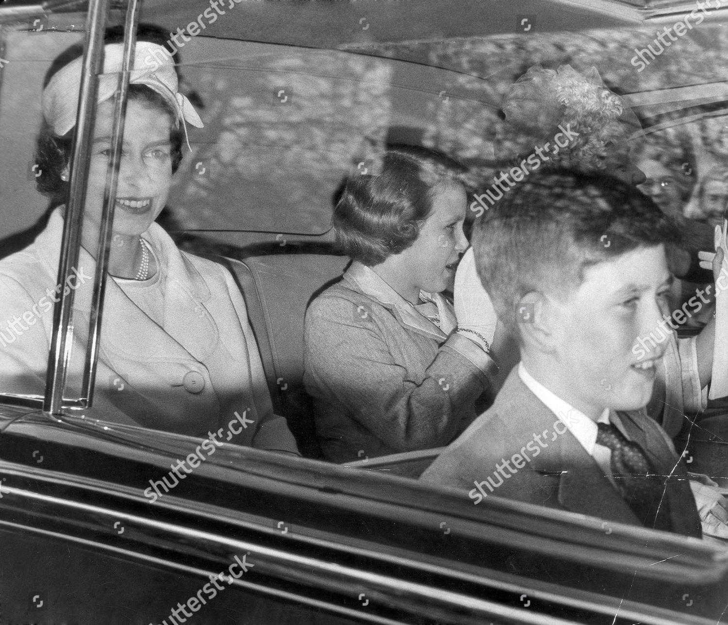the-queen-elizabeth-ii-prince-charles-and-princess-anne-in-a-car-going-to-a-wedding-rehearsal-may1960-on-their-way-to-the-abbey-the-queen-queen-mother-prince-of-wales-and-princess-anne-crowds-surging-cheering-crowds-the-royal-cars-were-surroun-shutterstock-editorial-894729a.jpg
