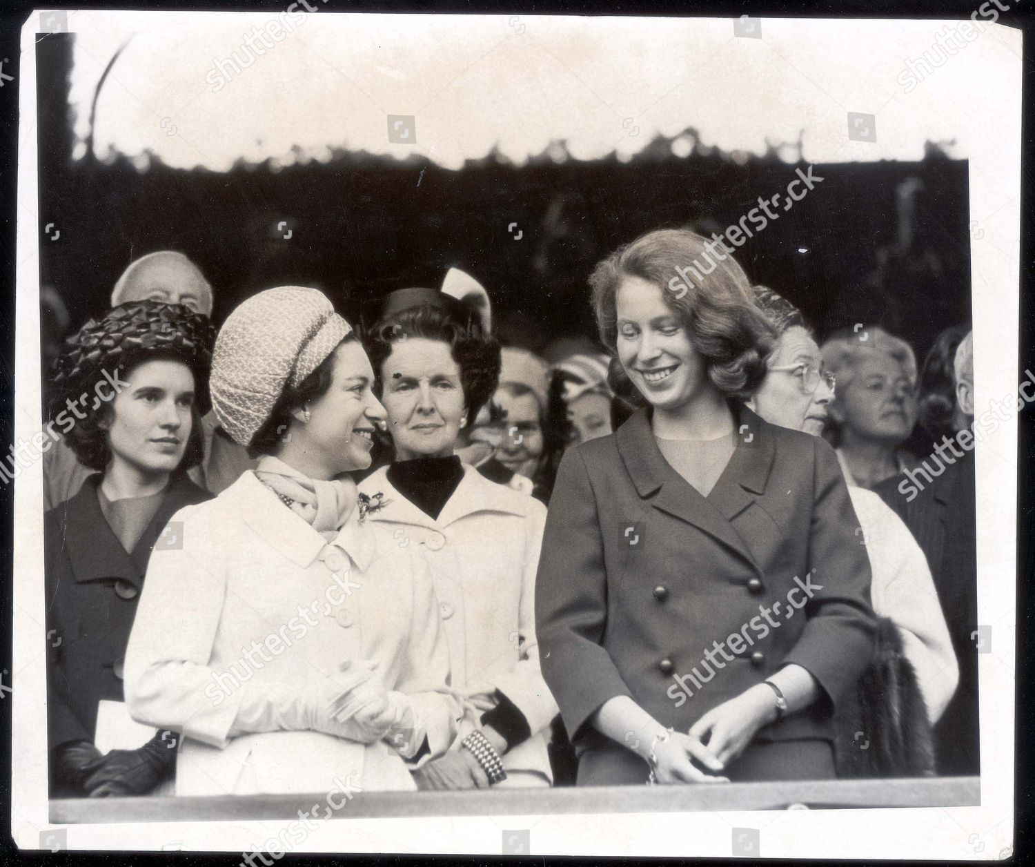 princess-margaret-turns-to-say-a-few-words-to-her-neice-princess-anne-in-the-royal-box-on-the-centre-court-at-wimbledon-today-friday-when-they-say-australias-roy-emerson-beat-fellow-countryman-fred-stolle-in-the-mens-singles-final-1965-shutterstock-editorial-896457a.jpg