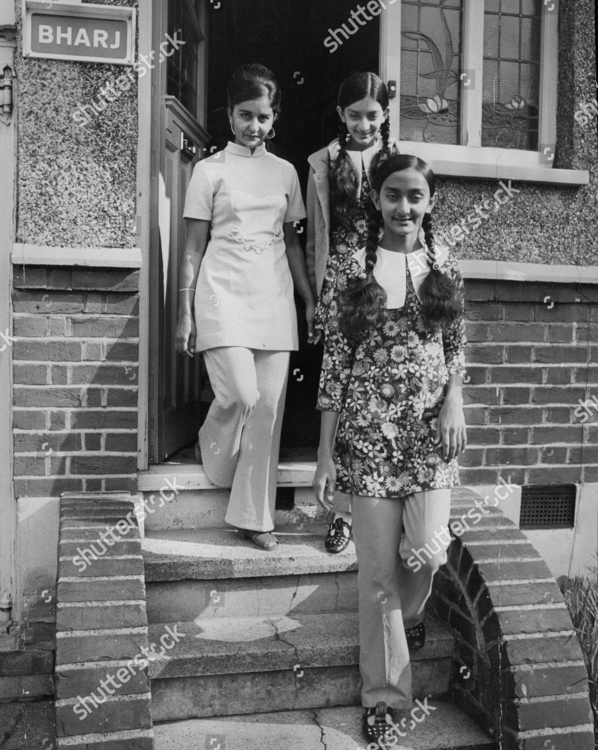 Stock photo of Asians Expelled From Uganda By President Idi Amin. Mrs Terchan Chana (l) And Daughters Inder 12 And Kaman 15 At Her Sister's Home In Harrow London. Box 745 207041737 A.jpg.