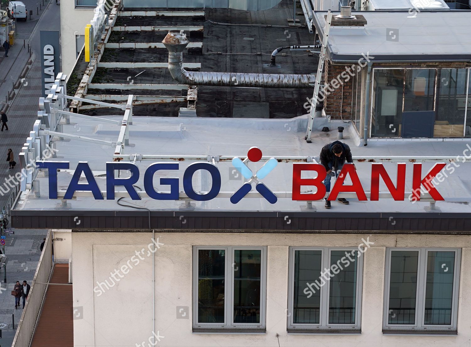 Worker Checks Condition Targo Bank Signage On Editorial Stock
