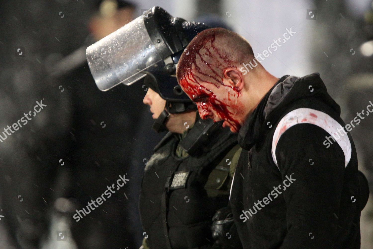 Serbian Police members arrest Partizan Belgrades hooligans ...