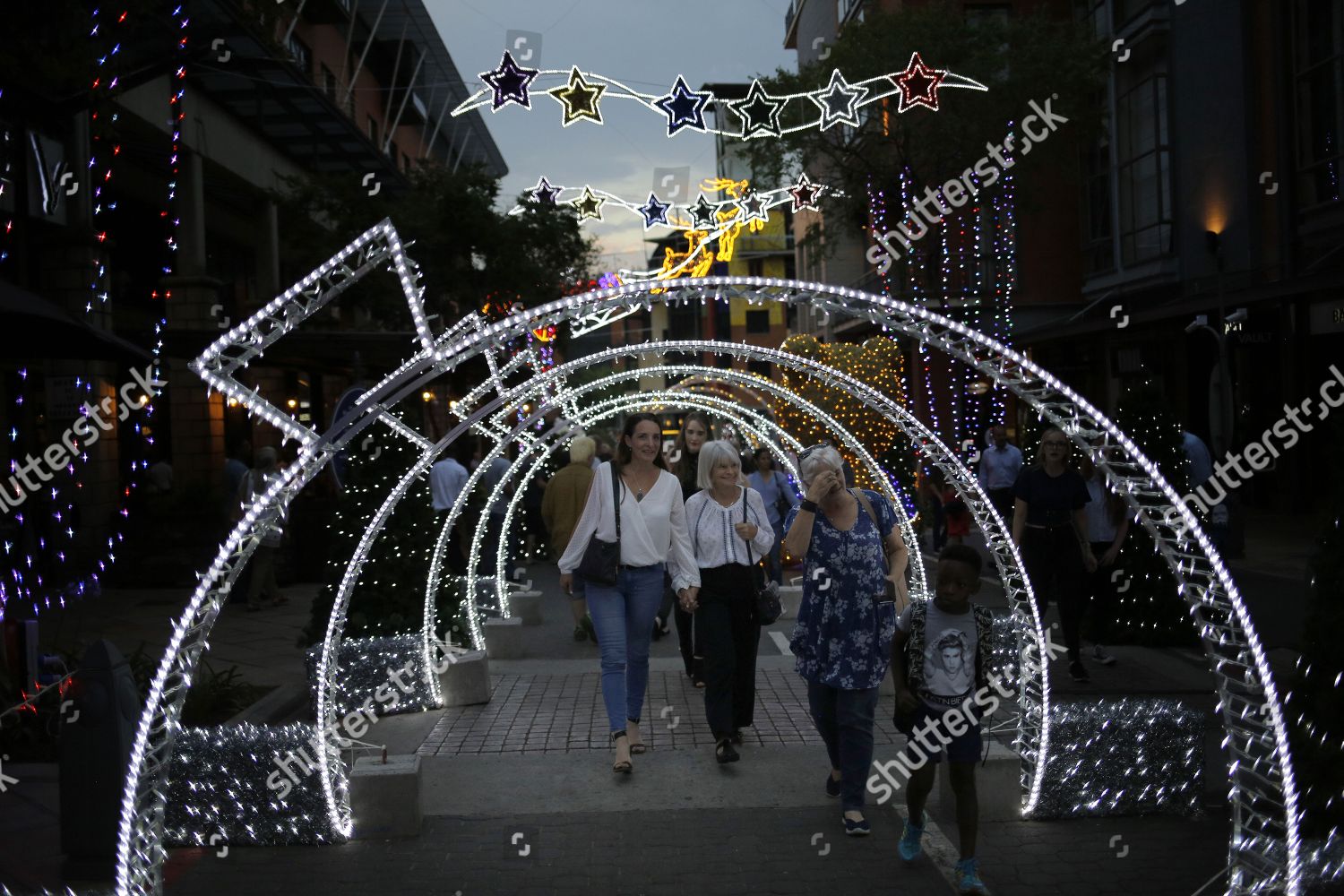 Some thousands people walk through Christmas lights Editorial Stock