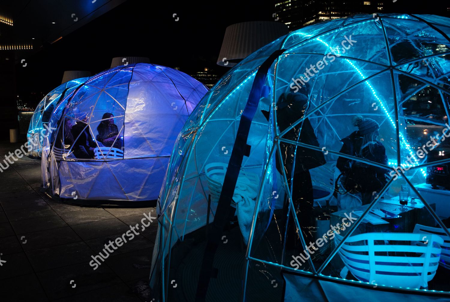 Patrons enjoy drinks rooftop igloo bar Envoy Editorial Stock Photo