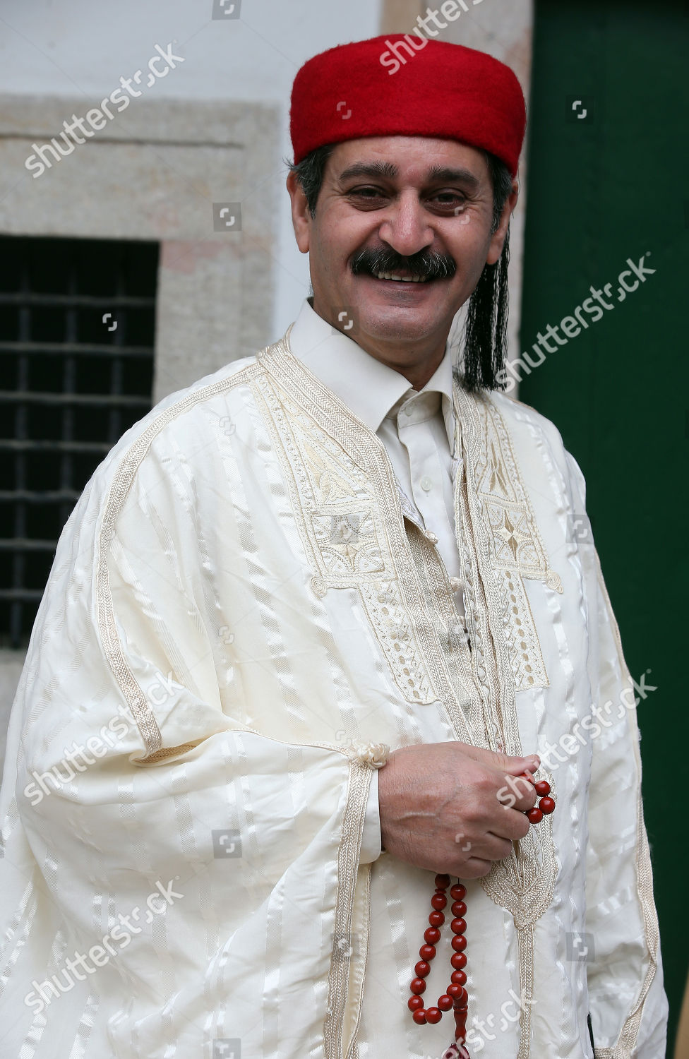 Tunisian man wears traditional clothing during National Editorial Stock