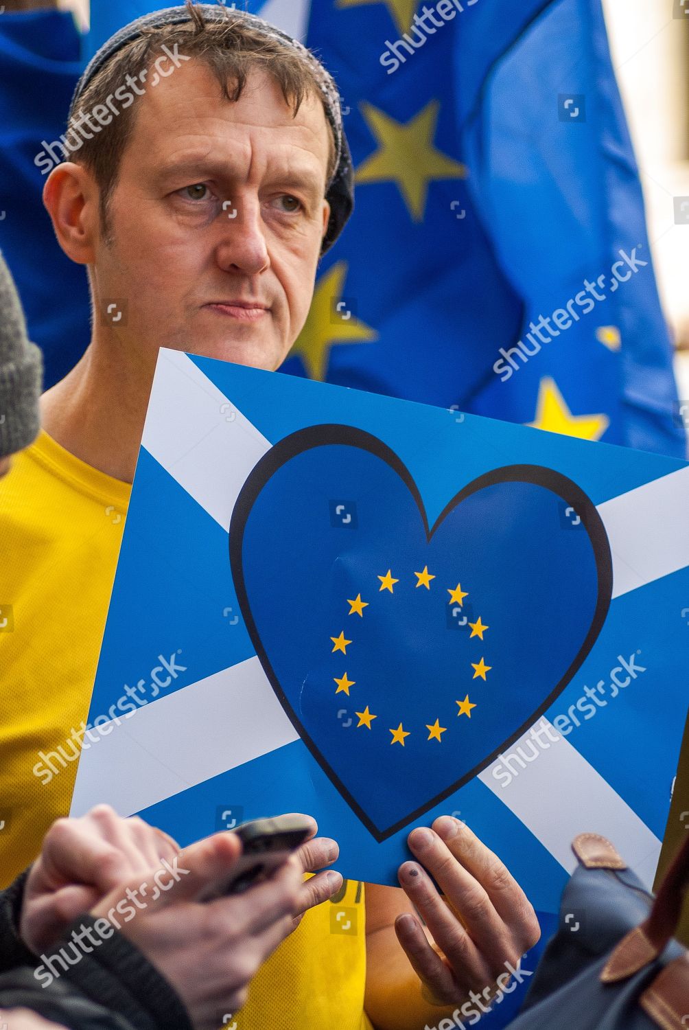 protester-hold-sign-depicting-scottish-flag-editorial-stock-photo