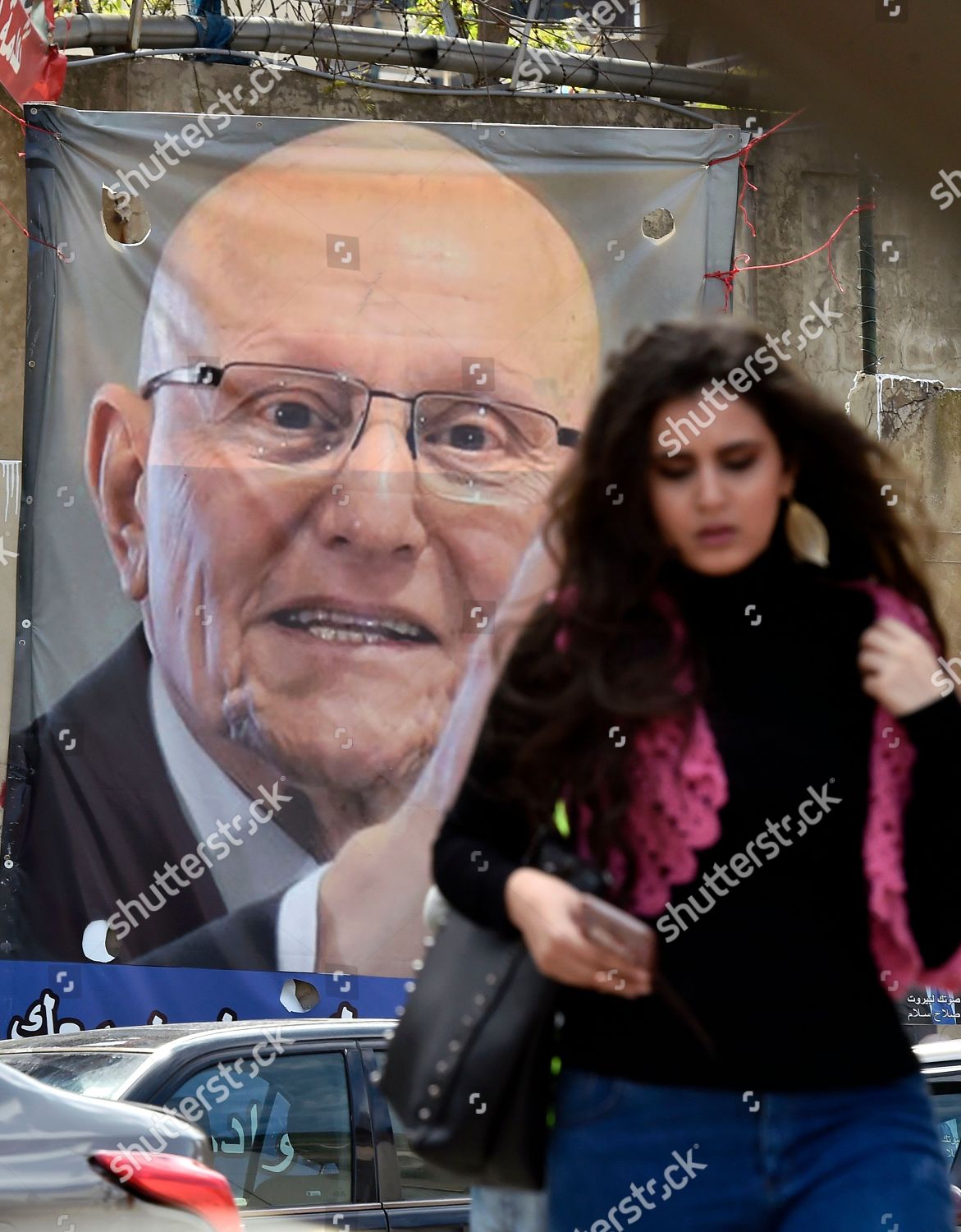 woman-walks-near-poster-depicting-former-editorial-stock-photo-stock