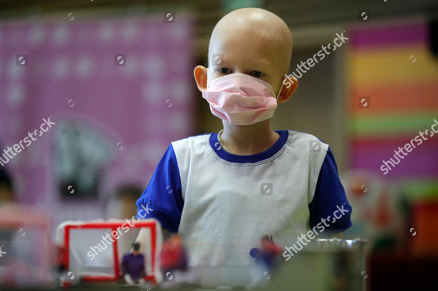 Boy Plays Table Hockey During Visit By Editorial Stock Photo