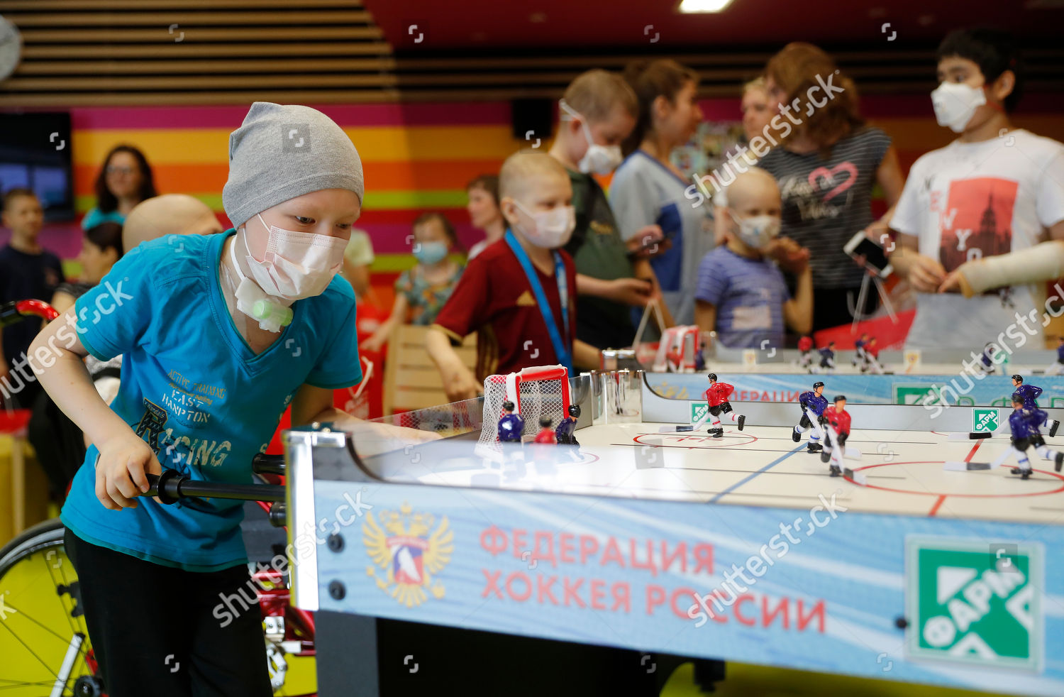 Children Play Table Hockey During Visit By Editorial Stock Photo