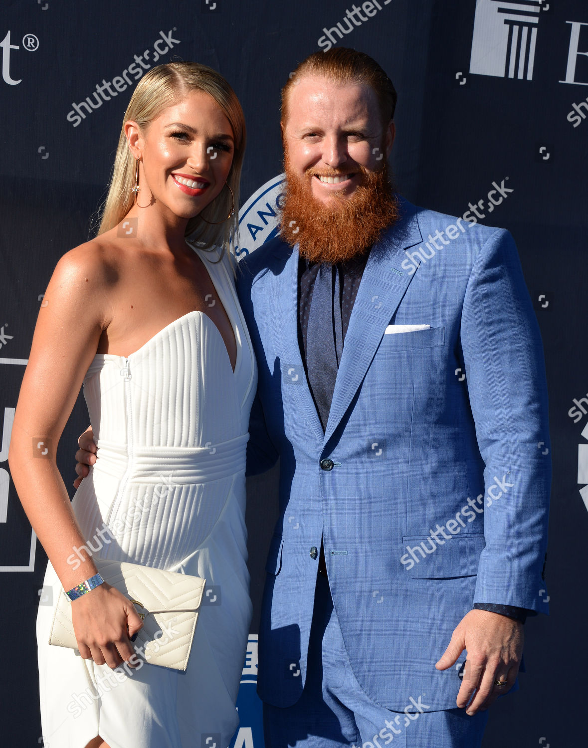 Justin Turner and wife Kourtney Turner after she sang the National News  Photo - Getty Images