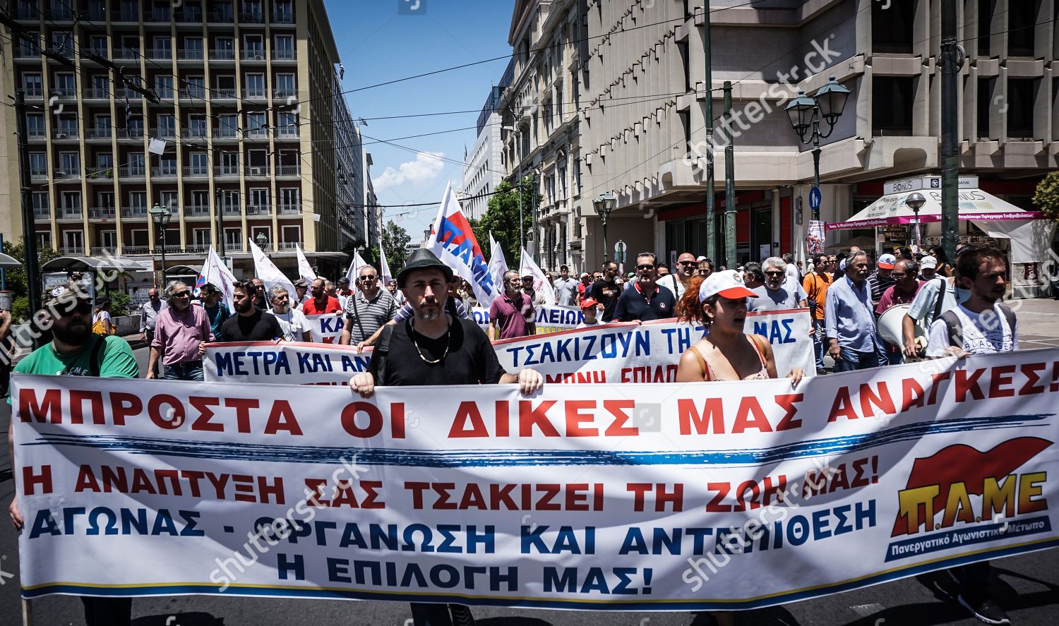 People March Protesting Huge Banner Flags Towards Editorial Stock