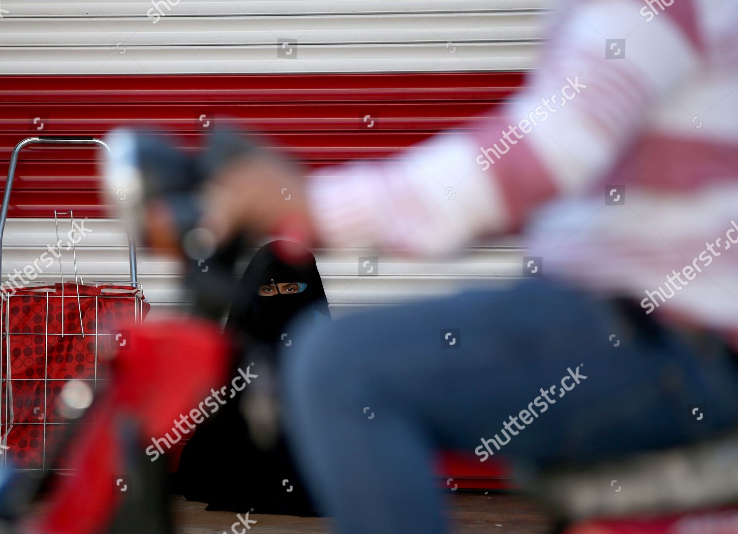 girl-chador-sits-next-closed-shop-editorial-stock-photo-stock-image