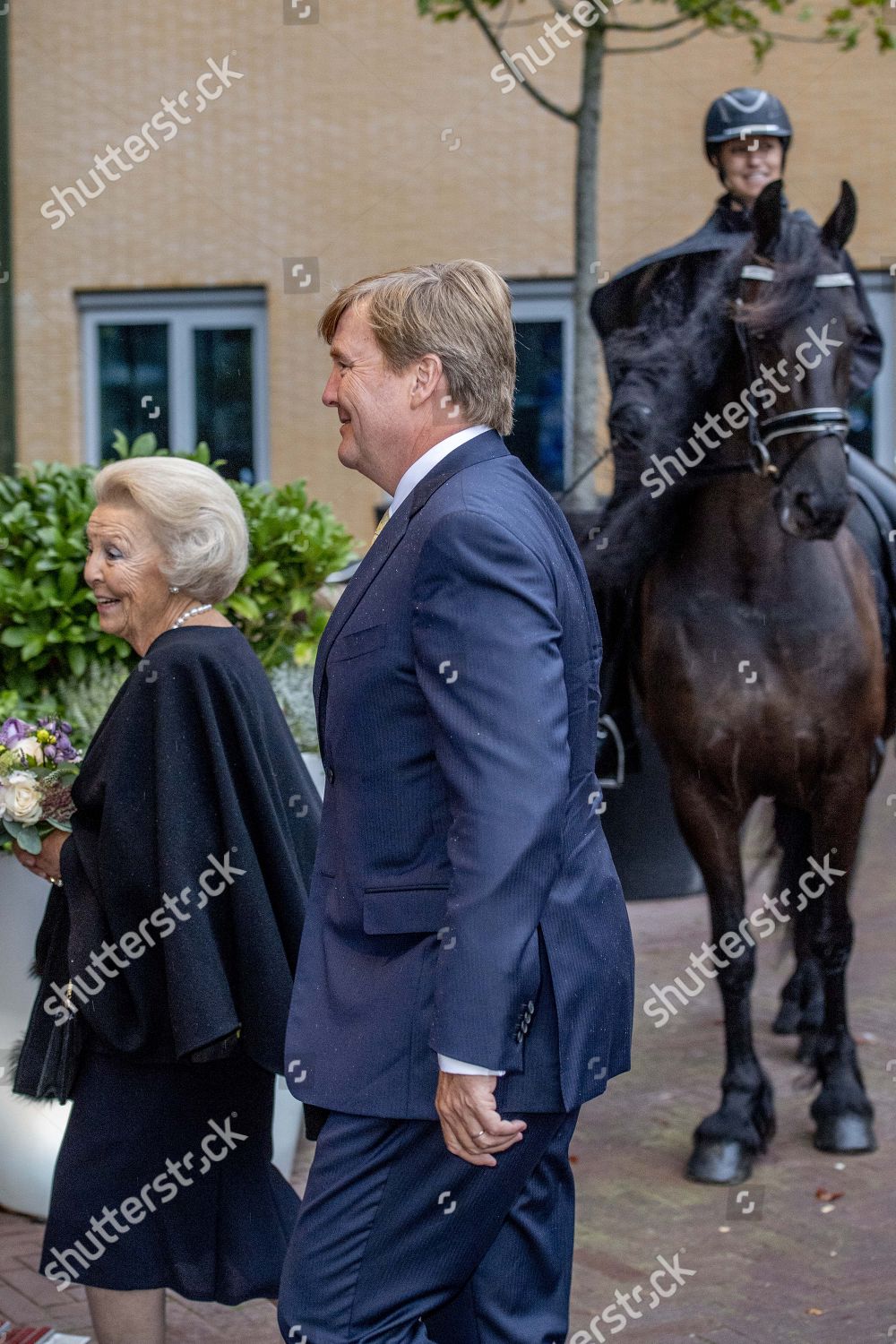 princess-beatrix-and-king-willem-alexander-at-the-premiere-of-theater-production-de-stormruiter-leeuwarde-the-netherlands-shutterstock-editorial-9877562at.jpg