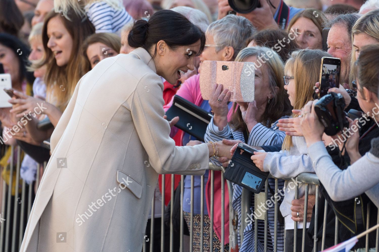 prince-harry-and-meghan-duchess-of-sussex-visit-to-sussex-shutterstock-editorial-9912872a.jpg