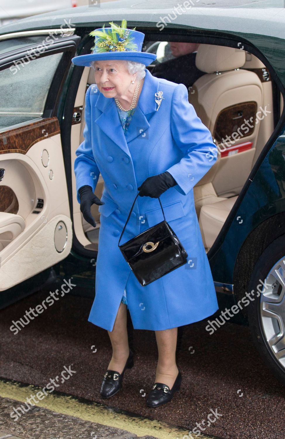 queen-elizabeth-ii-visits-the-royal-air-force-club-london-uk-shutterstock-editorial-9935966a.jpg