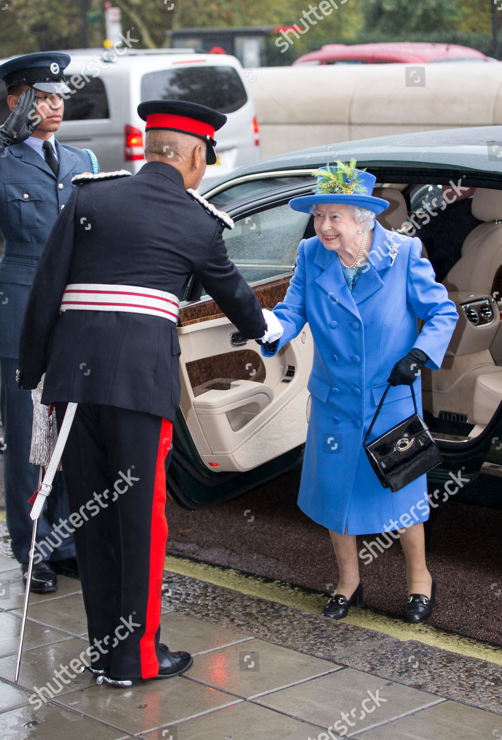 queen-elizabeth-ii-visits-the-royal-air-force-club-london-uk-shutterstock-editorial-9935966g.jpg
