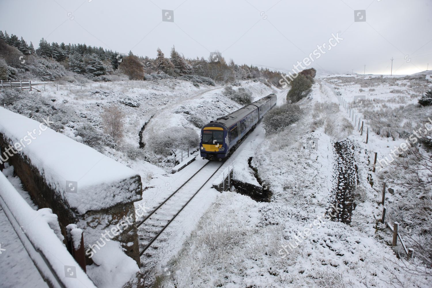 train battles through snow Sloch near Inverness Editorial Stock Photo