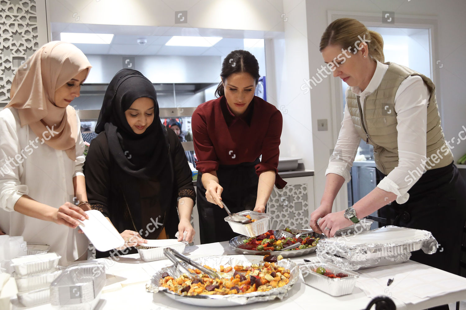 meghan-duchess-of-sussex-visit-to-the-hubb-community-kitchen-london-uk-shutterstock-editorial-9988987af.jpg