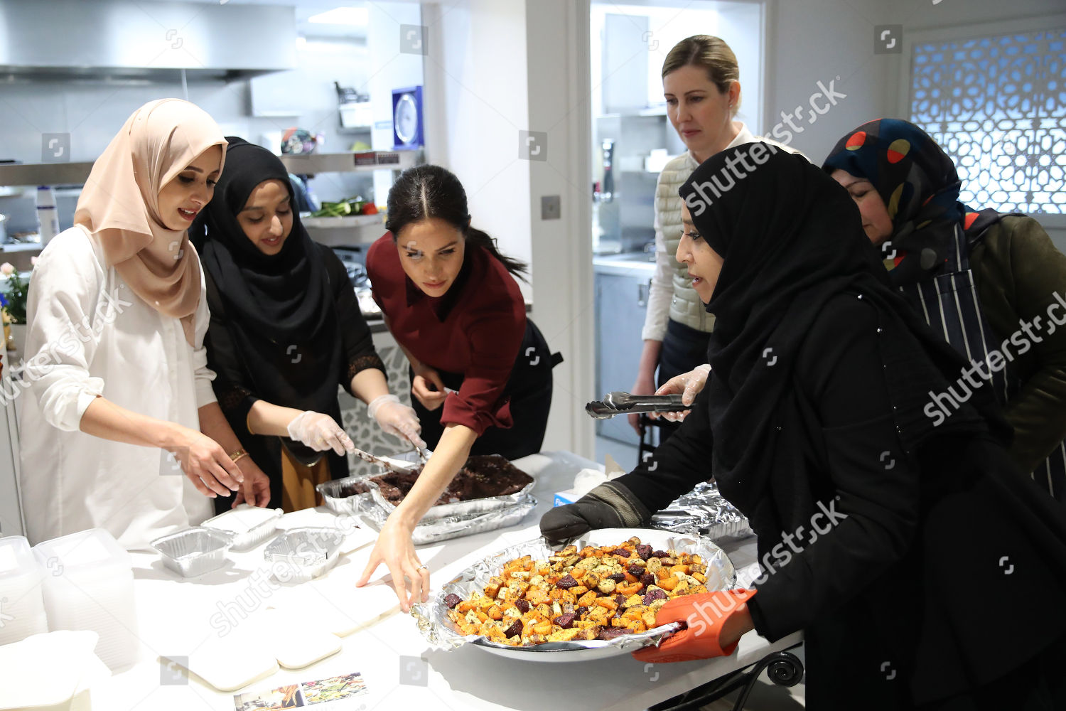 meghan-duchess-of-sussex-visit-to-the-hubb-community-kitchen-london-uk-shutterstock-editorial-9988987y.jpg