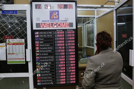 Woman Walks Past Board Foreign Exchange Rates Editorial Stock Photo - 